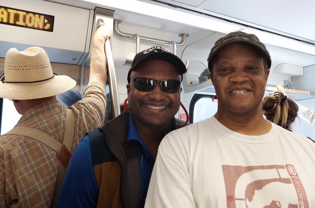 Curtis Finley and Tony Brown (L–R) ride the SMART Train on a preview ride, June 29, 2017.