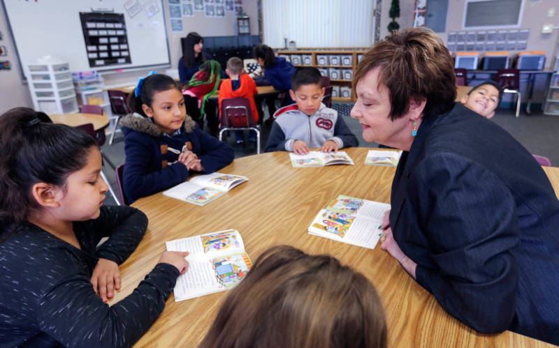 Teacher Dennise Carter works with a small group of students at Kendrick Elementary School in Bakersfield’s Greenfield Union School District. The district used some of the money it received for needy students under the state’s new school funding system to hire veteran teachers like Carter as academic coaches.