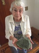 Doris Sloan, a retired geologist seen here holding a sample of serpentinite at her home in Berkeley, says during the time of the dinosaurs, the Bay Area was thousands of feet underwater.