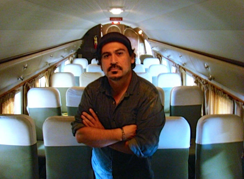 Author Tim Z. Hernandez inside a Douglas DC-3 airplane, similar to the one that crashed in 1948.