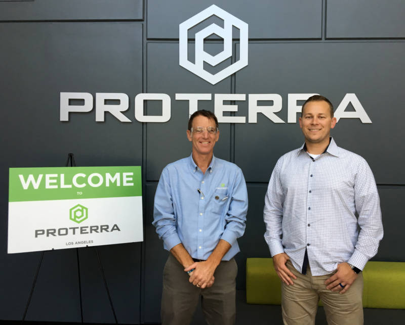 Paul Mottram (L), plant manager, and T.J. Nass, customer program manager at Proterra's City of Industry facility.