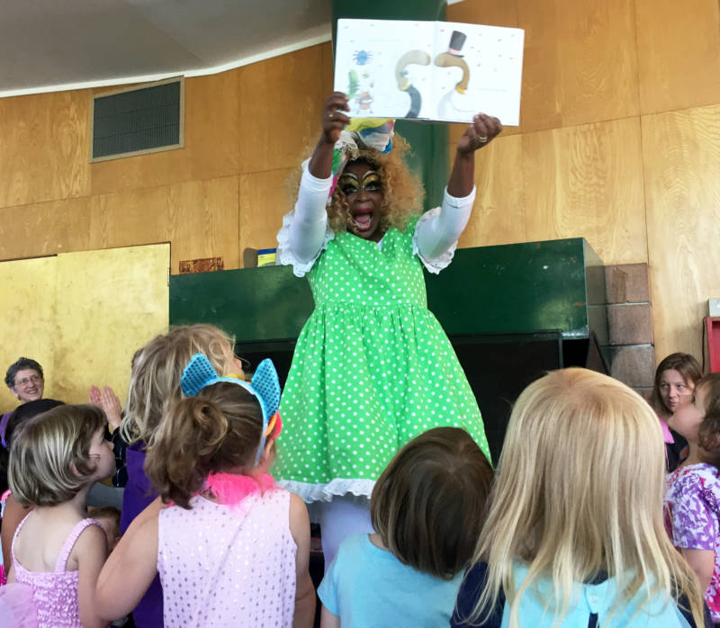 Black Benatar reads to children at Drag Queen Story Hour in Oakland.