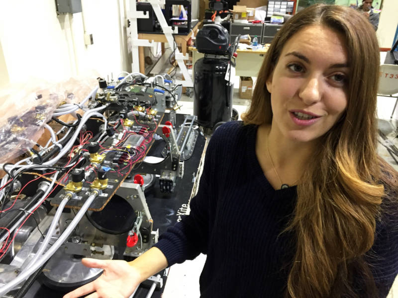 Arwa Tazani, manager of UC Irvine's HyperXite hyperloop project, shows off the inner workings of the 920-pound pod inside UCI's engineering building.