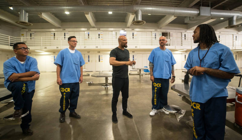 Common meets with inmates at a California prison.