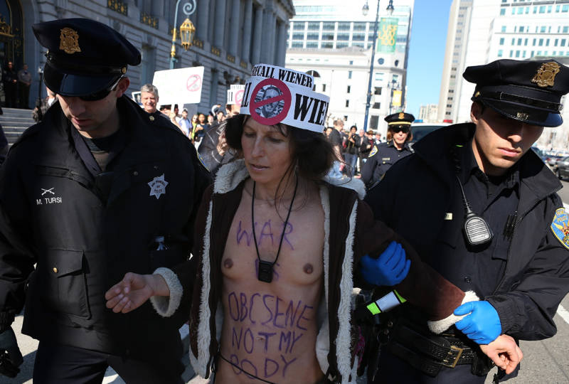 Nude activist Gypsy Taub is arrested by San Francisco police officers as he protests San Francisco's new ban on nudity at San Francisco City Hall on February 1, 2013.