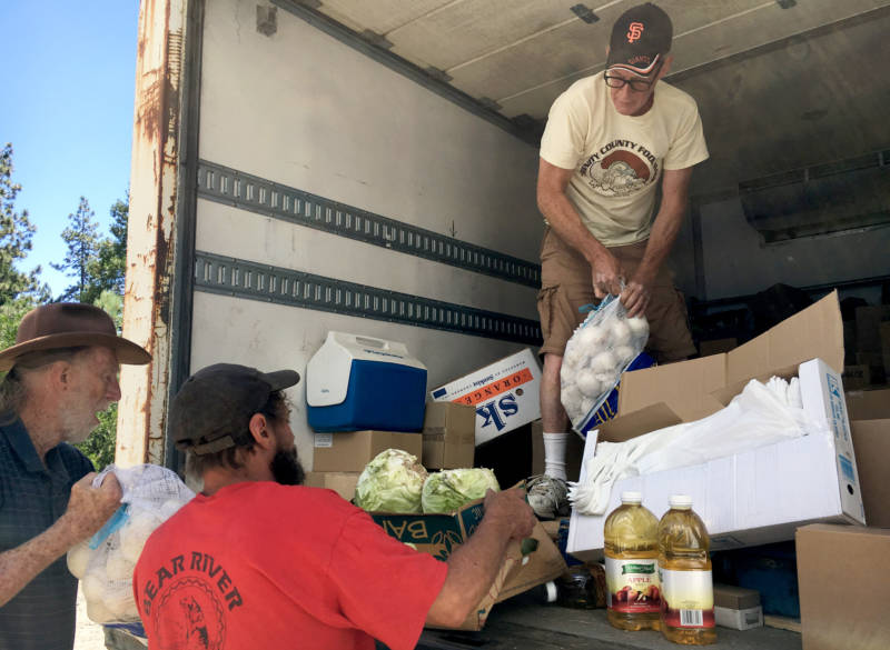 Jeff England, director of the Trinity County Food Bank, delivers items in remote Zenia, California. The closest large grocery store is 100 miles away.