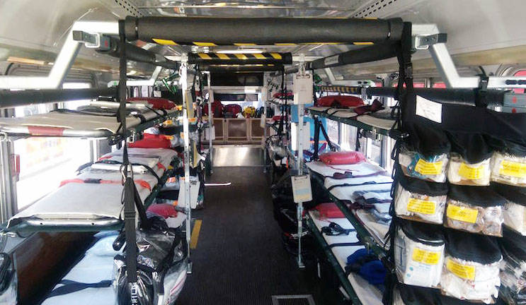 In a regular ambulance, “we would have cabinets where we could store all this equipment” says Zanoff. Here, they use a system of pouches that hang by the backdoor of the bus.