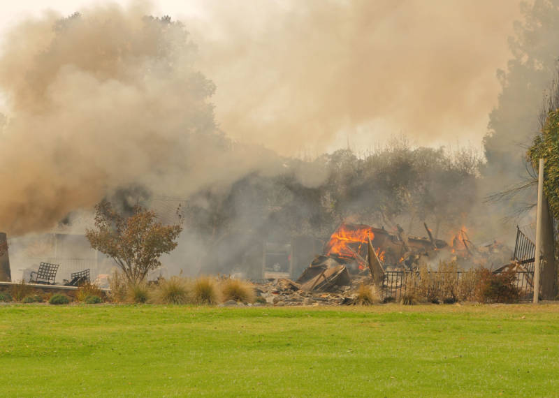 The remains of a home burn next to the golf course at the Silverado Resort and Spa in Napa.
