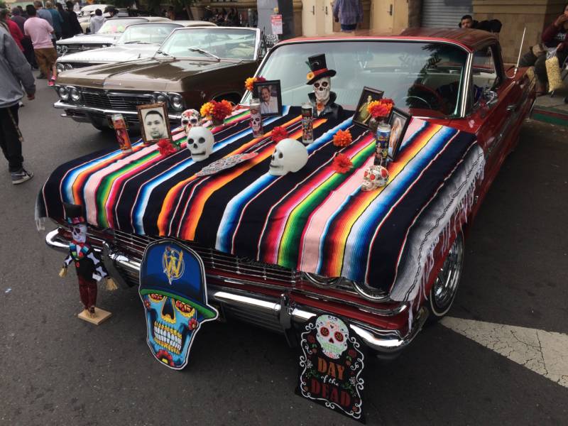 This altar was created on the hood of a car. Altars are a way to honor the memory of loved ones. 