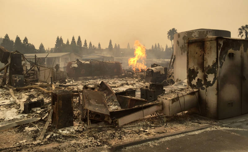 Destroyed homes smolder at Journey’s End Mobile Home Park in Santa Rosa.