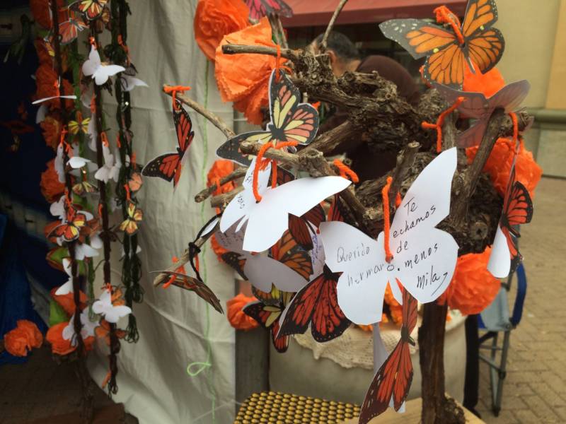 Artist Alicia Diaz included a tree of butterflies with the names of loved ones on her altar. Monarch butterflies are thought to help guide spirits home.