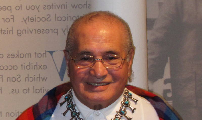 Jose Sarria posing during a visit to the GLBT Historical Society in 2009.