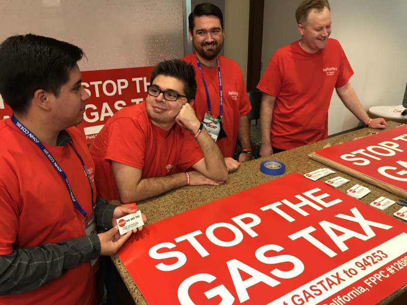 Volunteers at the GOP convention in Anaheim staff a table promoting a repeal of the recent gas tax increase.