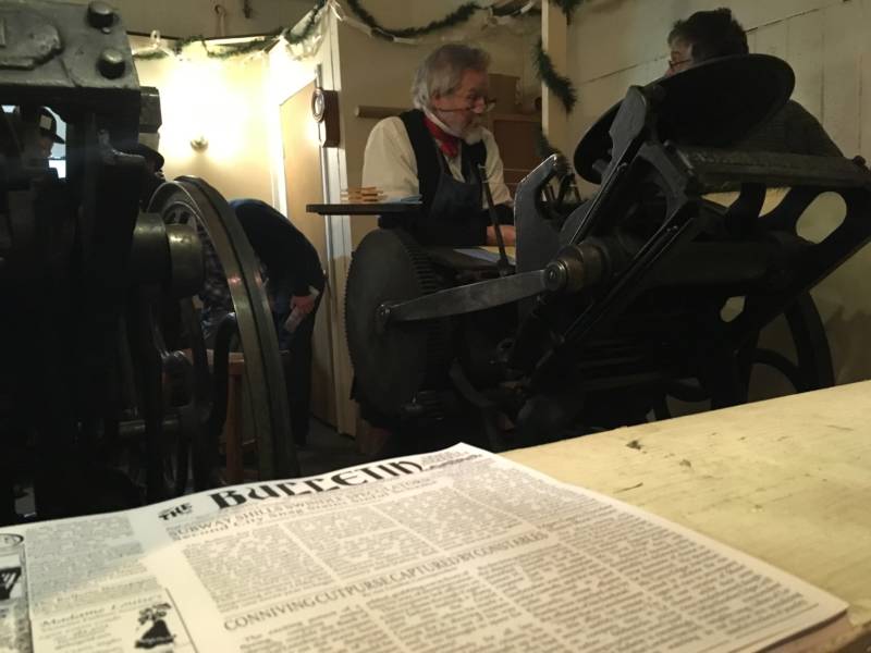 A real printing press is used throughout the fair, one of many touches that makes the experience feel like stepping into another era. 