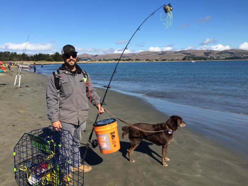 Garret Medeiros, of Novato, and his dog joined other eager fisherman for opening day.