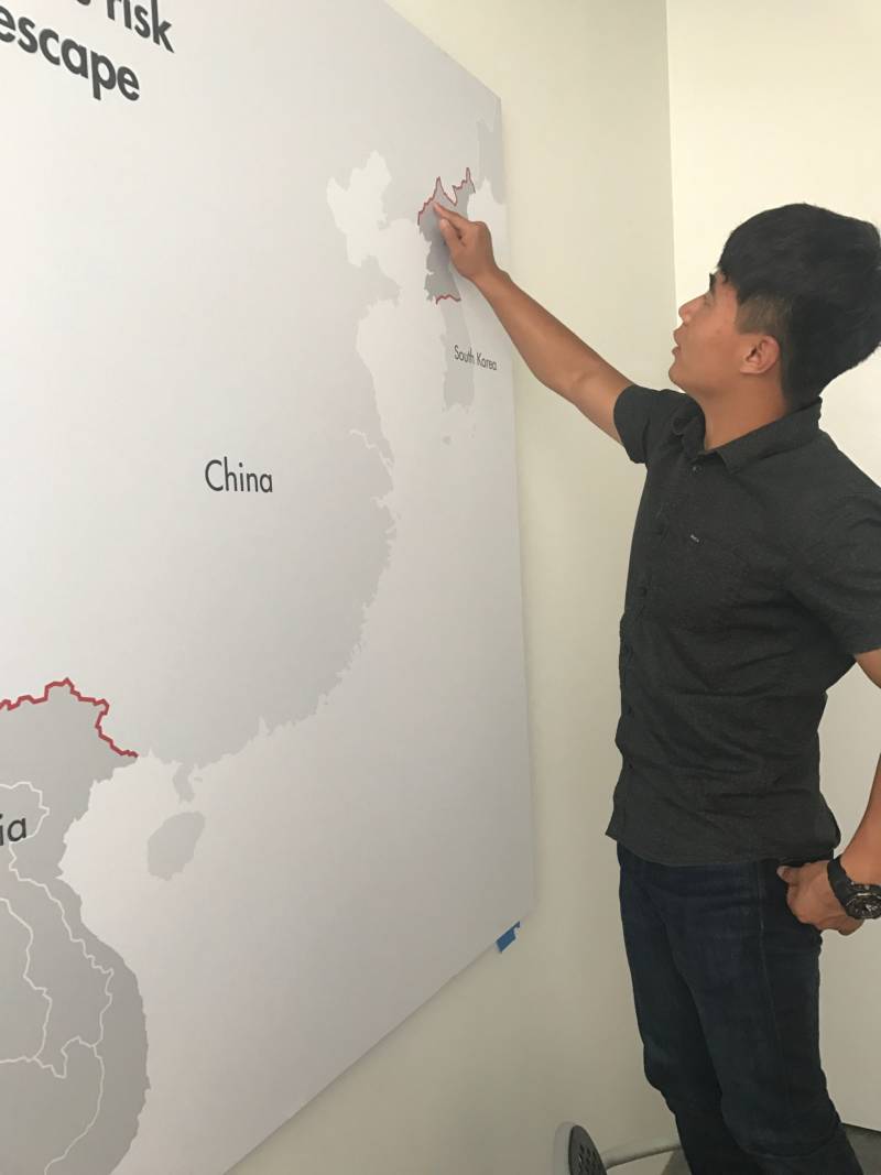 In the offices of LiNK (Liberty in North Korea), Cheol "Charlie" Ryu points at the approximate spot, on the Chinese-North Korean border, where he crossed the Yalu River to defect.