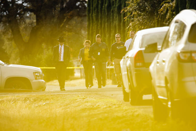 FBI agents are seen behind yellow crime scene tape outside Rancho Tehama Elementary School after a shooting in the morning on November 14, 2017, in Rancho Tehama. 