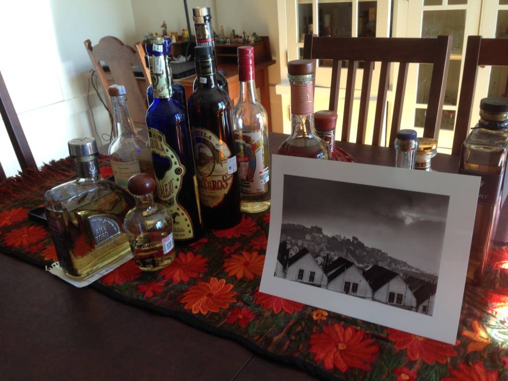 Fred Lyon gave Robert Aranda Jr. a digital print of his "Houses on the Hills" photograph. It is temporarily keeping company with tequila bottles on Aranda's dining room table in the Noe Valley neighborhood of San Francisco.