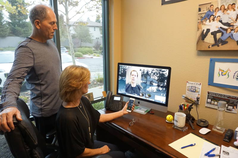 Kim and Russ Nash Skype with their sons Kyle and Austin, who run the San Diego office. 