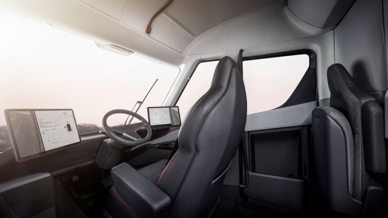The driver's seat of the Tesla Semi is positioned in the center of the cab — which also provides standing room, the company says.