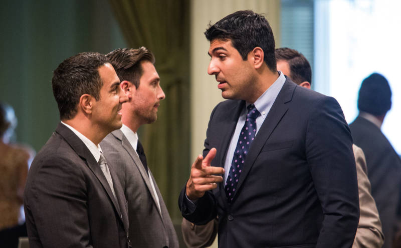 Assemblyman Matt Dababneh (D-Woodland Hills) (AT RIGHT) talks with colleagues in 2015.