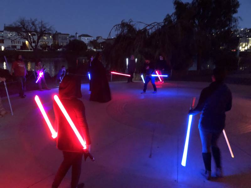 Lightsabers light up the night as students wrap up a Saber Guild class. 