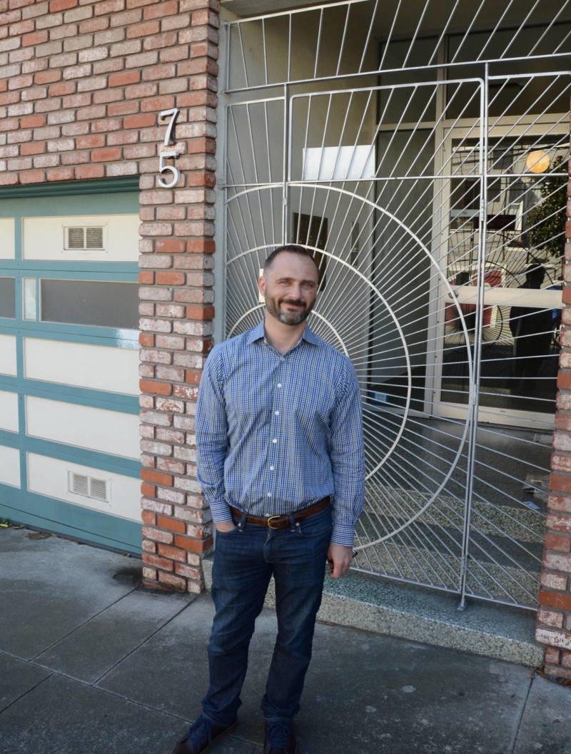 LGBTQ historian Don Romesburg stands in front of the Castro apartment building he was priced out of in 2011. "There was absolutely no way we could afford anywhere else remotely close to the Castro," Romesburg said.