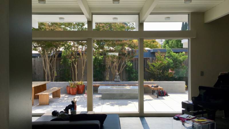 Floor-to-ceiling windows in Edita Donnelly's Palo Alto living room draw the eye to the backyard. This is what "indoor/outdoor" living means.