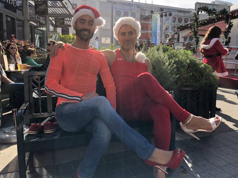 Sam and Francisco Presley just after changing into their high heels for SantaCon 2017 at San Francisco's Union Square. They said they wanted to come out to see the creativity because they didn't have Christmas in their home country of Iran.