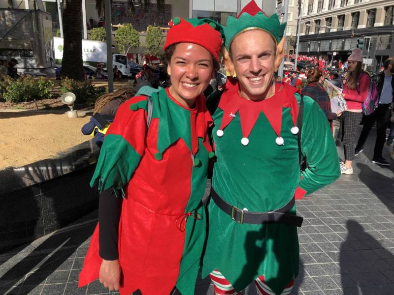 Eve Sotomayor and Scott Merrick dress as elves at SantaCon 2017 in San Francisco's Union Square. Sotomayor and Merrick know each other from South Carolina and both recently moved to the city. Merrick said when they heard about SantaCon, they decided, "We'll do that instead of going on a hike."