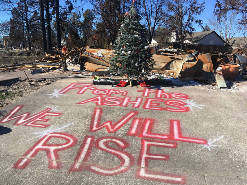 A Christmas tree stands in front of a home destroyed by October's fires in Santa Rosa. 