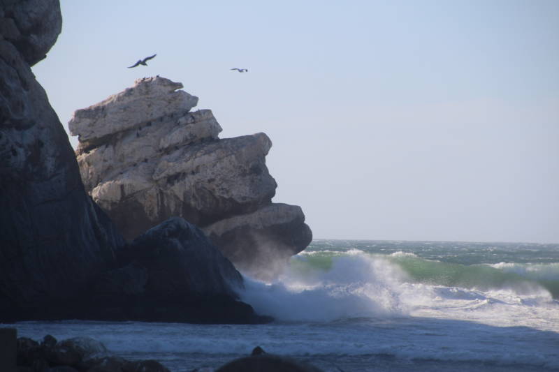 The Pacific Ocean crashes against Morro Rock, a sacred place to Salinan Indians.