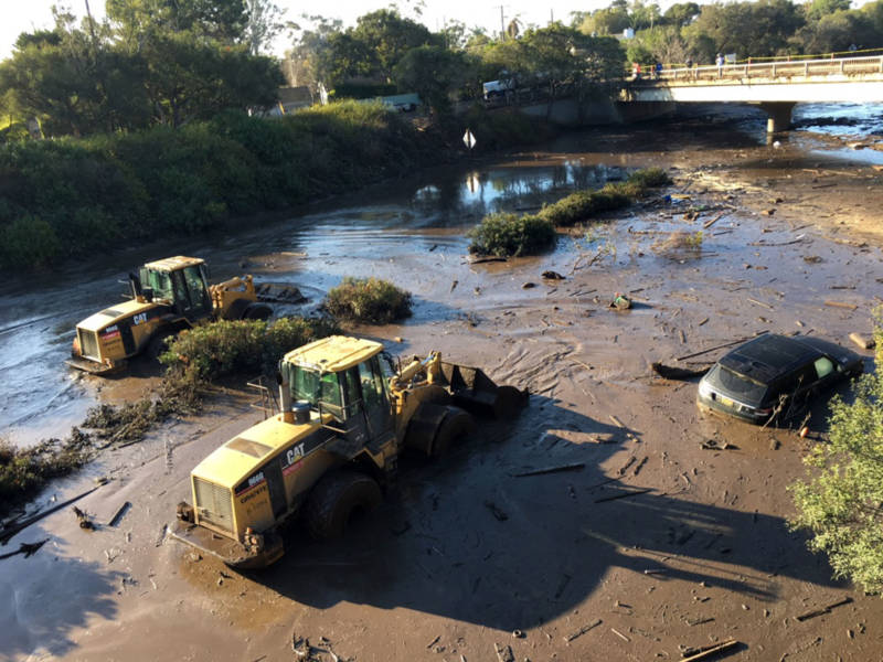 Bulldozers plow through mud and muck on the 101 Freeway on Thursday, Jan. 11, 2018, following the devastating mudslides that killed at least 17 people and destroyed dozens of homes in Santa Barbara County.