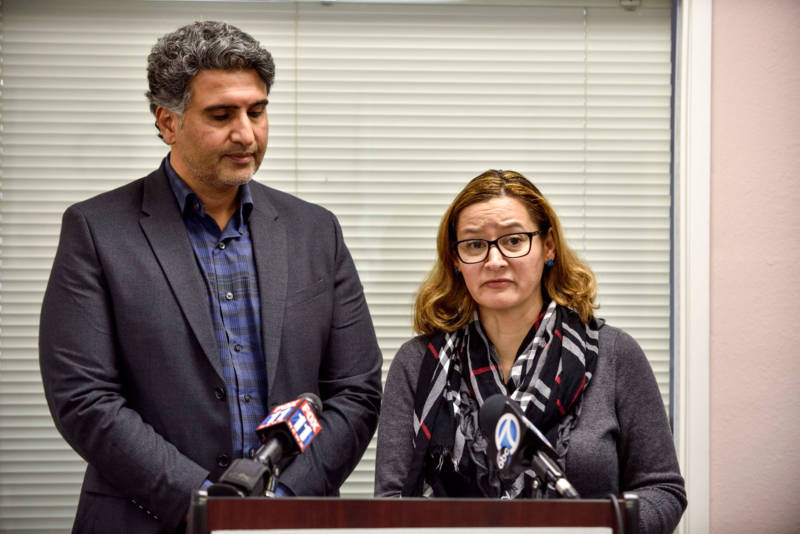 Azfar Quddus and Carolyn Rodriguez-Quddus make a statement to the media during a press conference in Anaheim on Jan. 11, 2018.