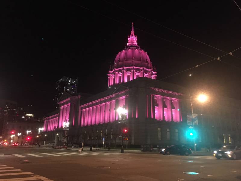  San Francisco City Hall is lit up pink at night on Saturday, Jan. 20, 2018. Earlier in the day, tens of thousands of women gathered in front of City Hall and marched down Market Street as part of the 2018 Women's March.