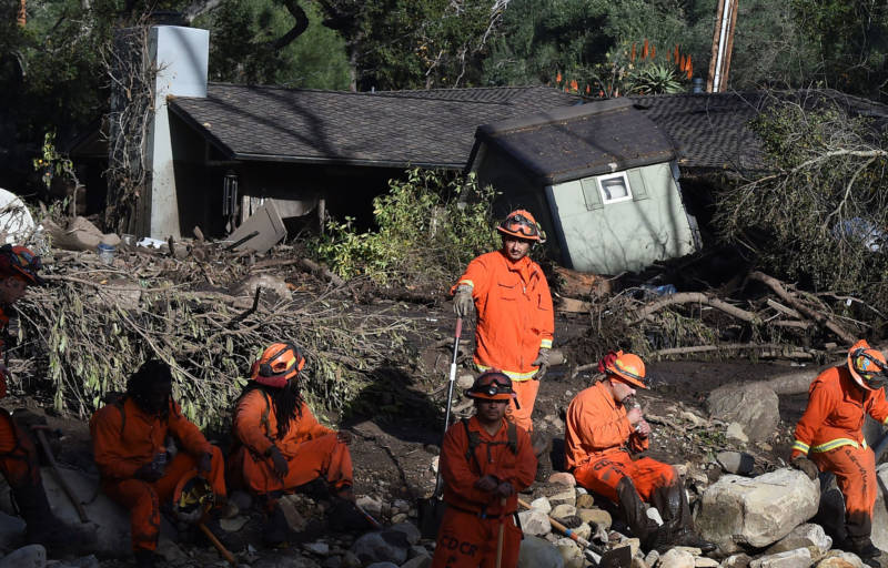A Cal Fire inmate crew rests while looking for victims of a massive mudflow in Montecito on January 10, 2018.