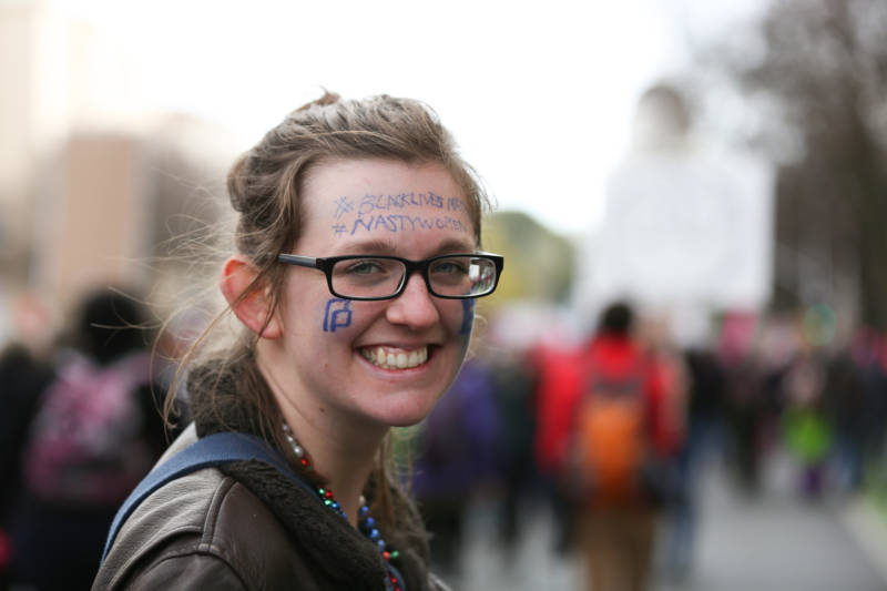 Barbara Wortham of Davis marched down the Capitol Mall during the Sacramento Women's March on Saturday, Jan. 21, 2017. She painted her face with the logo for Planned Parenthood and the hashtags #blacklivesmatter and #nastywomen.