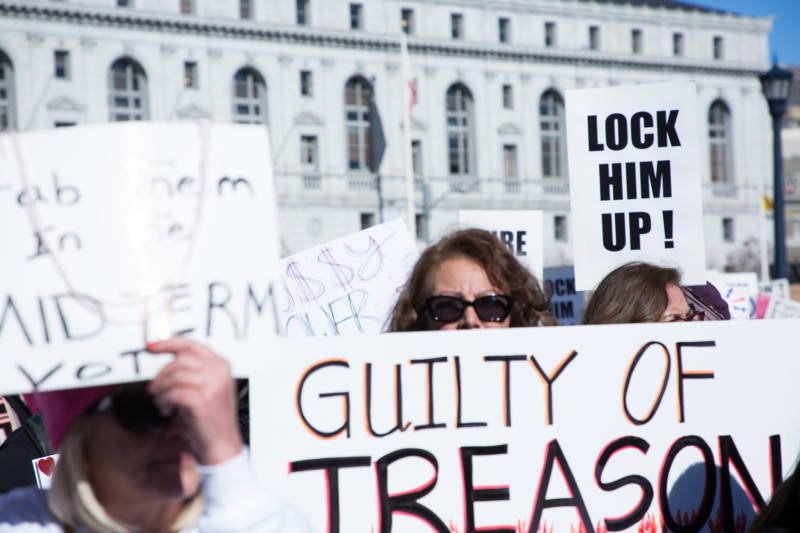 People were passing out "Lock Him Up" signs at the San Francisco Women's March, referring to President Donald Trump.