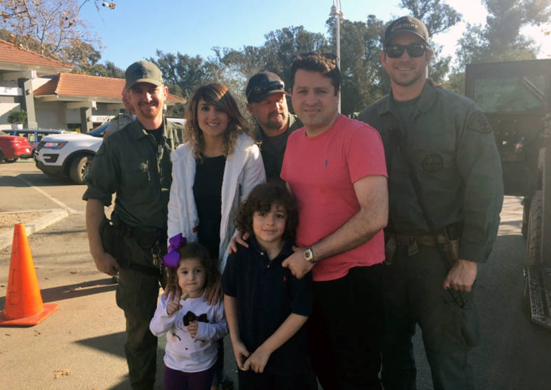 Sally Barati, her husband Shawn Babaieamin and their children had been trapped in their home for three days before these deputies from the Santa Barbara County Sheriff’s Department rescued them from a second story window.