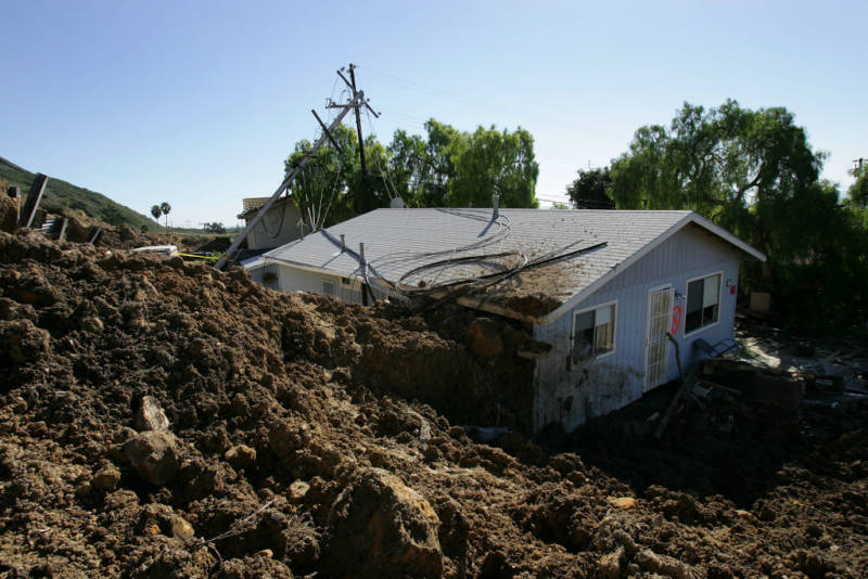 A home damaged in the deadly mudslide that killed at least 10 people is one of those that residents will not be allowed to enter on the first day that evacuated residents are allowed to return to their devastated community January 14, 2005 in La Conchita, California. With at least three people still missing, rescuers suspended search efforts after the hillside above shifted, raising concern that another mudslide could occur. 15 homes were destroyed and 16 damaged when the mudslide poured over part of the small seaside town of 260 people at the end of the area's heaviest rainfall in a 15-day period since records began in 1921.