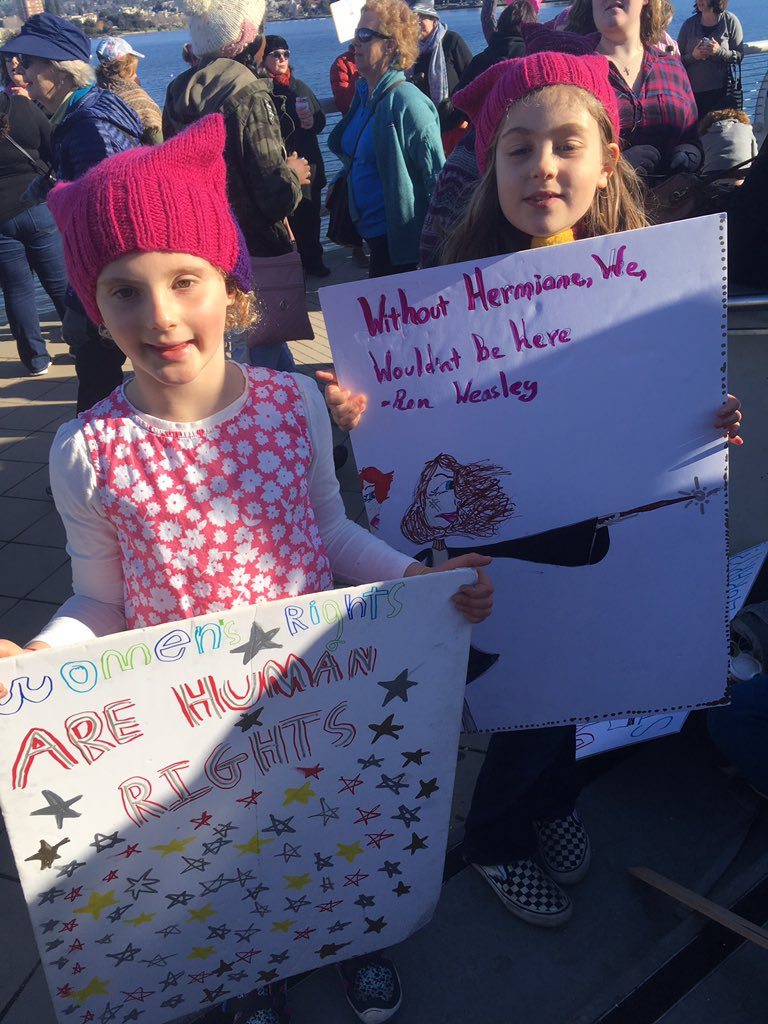 Cora Tivol and Keely Shaller are at the Oakland Women's March with their parents. 