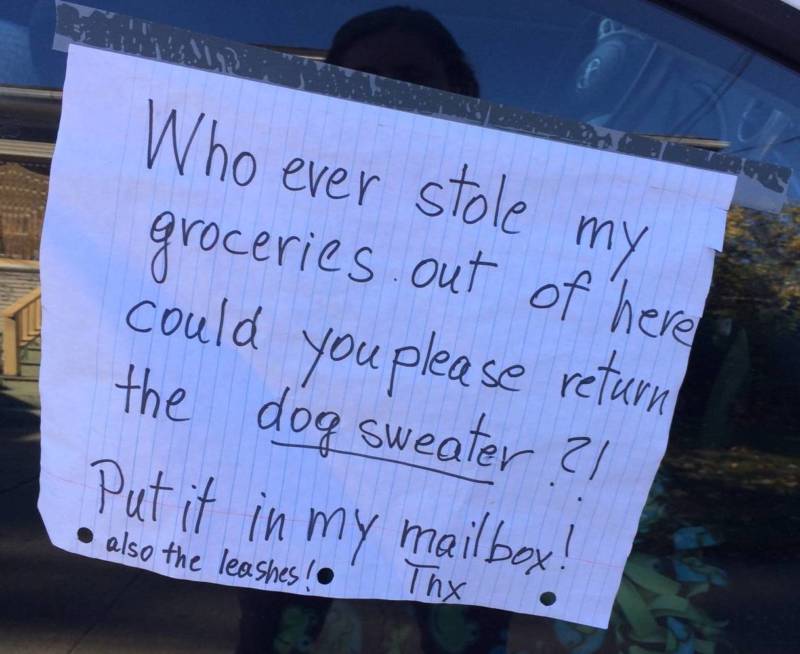 A car parked in the Temescal Neighborhood of Oakland, Calif. with a sign asking for a car thief to return a sweater.