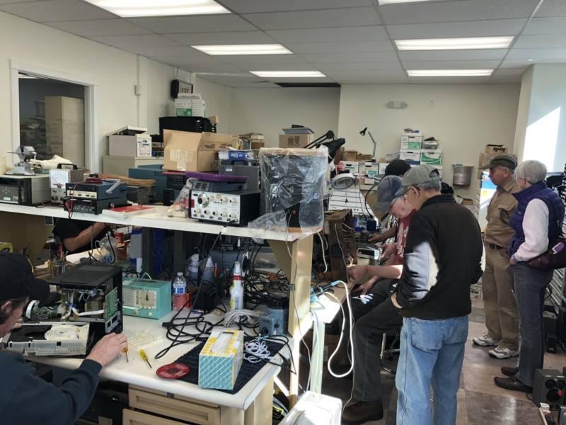 Members of the California Historical Radio Society tinker with old AM/FM radios at the society's building in Alameda on February 3, 2018.