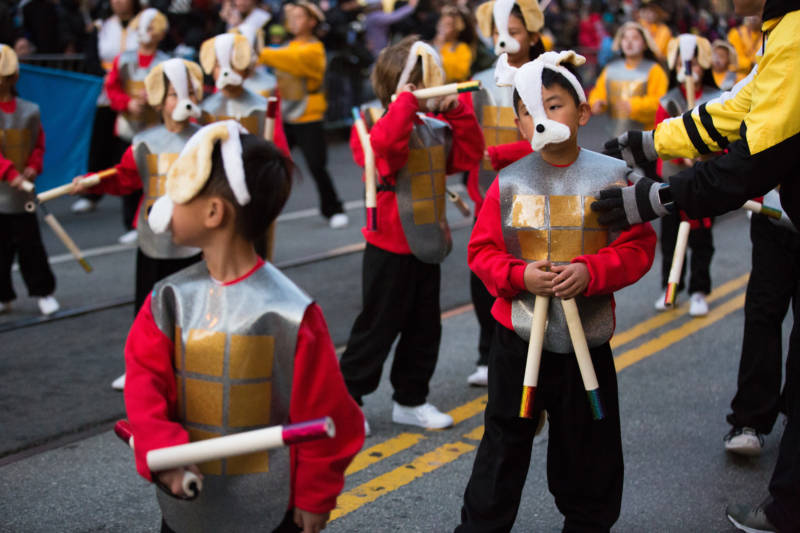 Students from the Tat Wong Kung Fu Academy show off their best moves to the crowd while marching in the Lunar New Year Parade in San Francisco.
