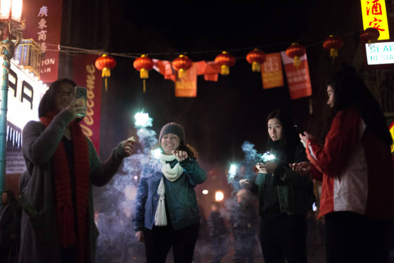 After the parade, participants of all ages lit up the streets of Chinatown by lighting sparklers and firecrackers.