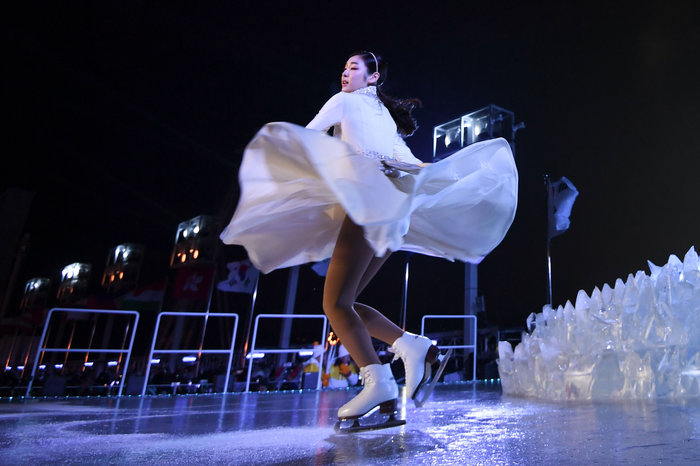 South Korean figure skater Yuna Kim performs before lighting the Olympic cauldron.