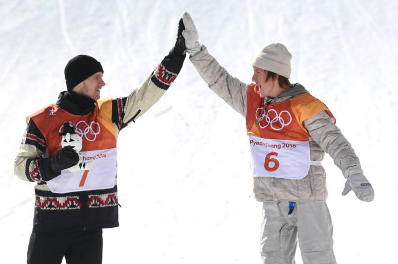 Seventeen-year-old Red Gerard (right), the first Team USA gold medalist of the Pyeongchang Games, gives Canadian silver medalist Max Parrot a high-five during the victory ceremony for men's snowboard slopestyle.