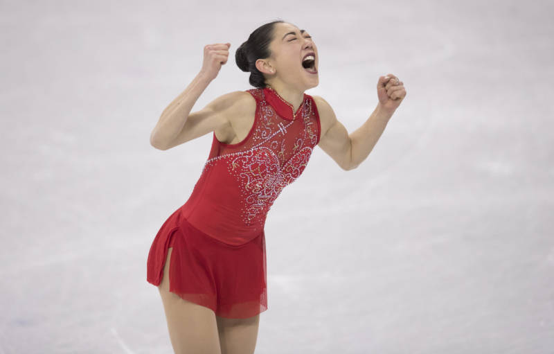 Mirai Nagasu of the United States exults after landing a triple axel during the team figure skating event. Nagasu is the first American woman to successfully complete the jump at the Olympics.
