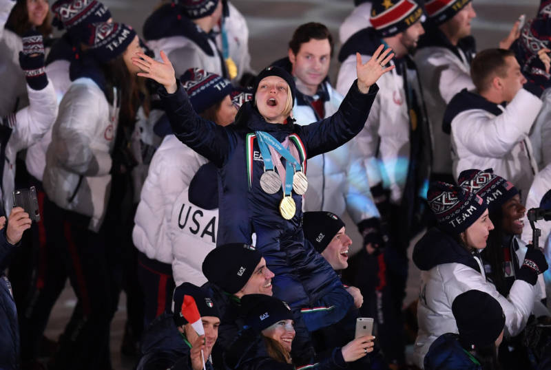 Four-time Olympian Arianna Fontana of Italy, celebrating in the Parade of Athletes, won gold, silver and bronze in Pyeongchang.