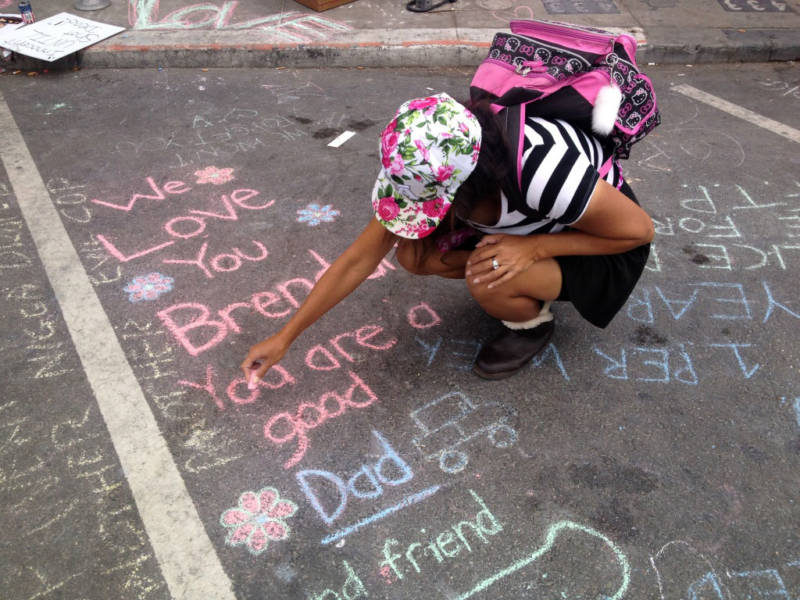 Friends of Brendon Glenn wrote in chalk on the pavement where he died after being fatally shot by an LAPD officer May 5, 2015.